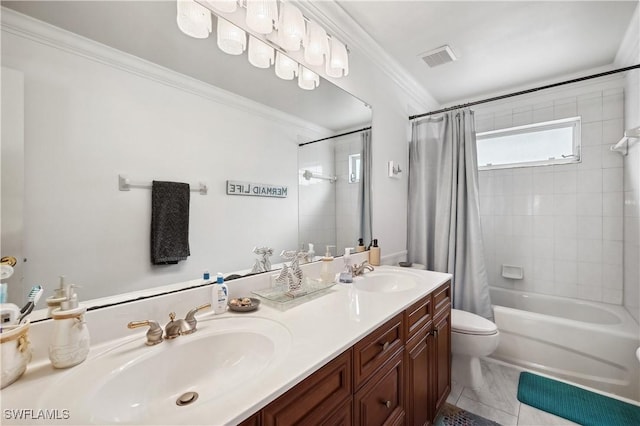 bathroom featuring toilet, shower / bath combo with shower curtain, a sink, and ornamental molding