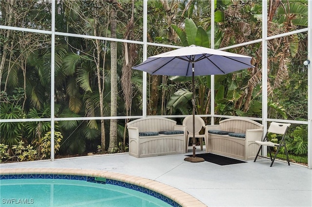 view of swimming pool featuring a lanai, a patio, and an outdoor living space