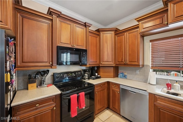 kitchen with brown cabinets, light countertops, and black appliances