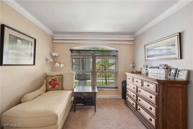 living area with ornamental molding, baseboards, and light carpet