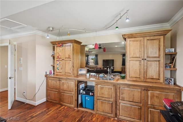 interior space featuring crown molding, dark wood finished floors, brown cabinetry, open shelves, and a sink