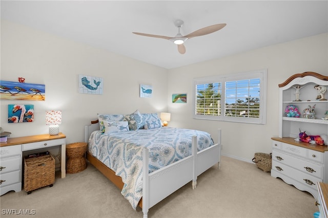 bedroom featuring a ceiling fan and light carpet