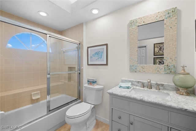 full bathroom with baseboards, toilet, enclosed tub / shower combo, vanity, and recessed lighting