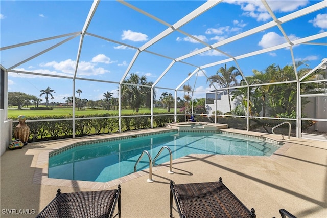 view of pool with a patio, a lanai, and a pool with connected hot tub