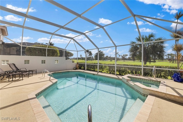 view of pool with a lanai, a pool with connected hot tub, and a patio