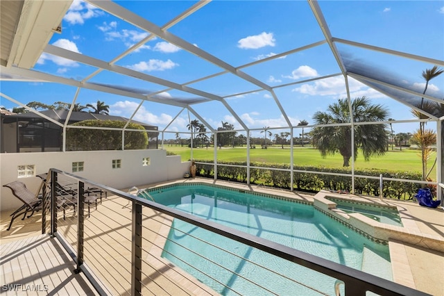 view of pool with glass enclosure, a patio area, and a pool with connected hot tub