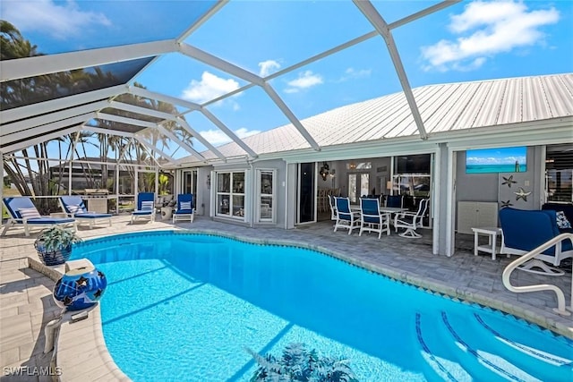 pool featuring a lanai and a patio