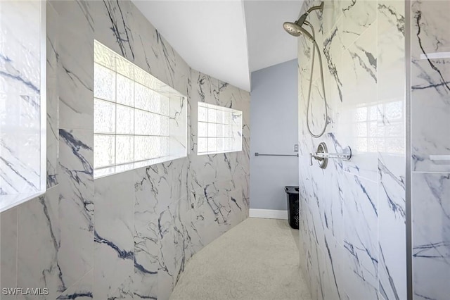 full bath featuring a marble finish shower