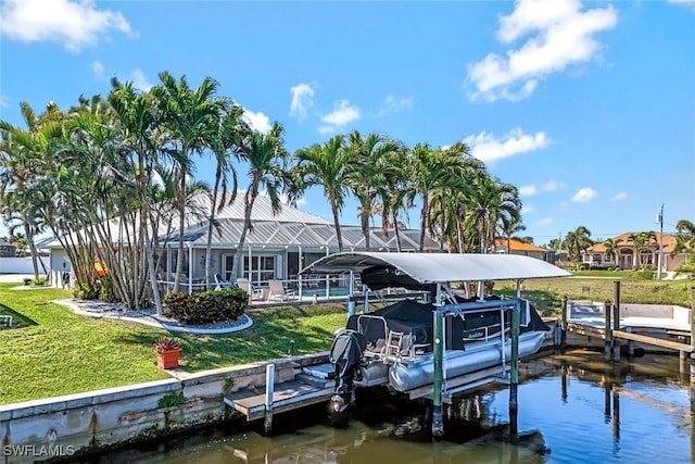 view of dock with a water view, glass enclosure, boat lift, and a yard