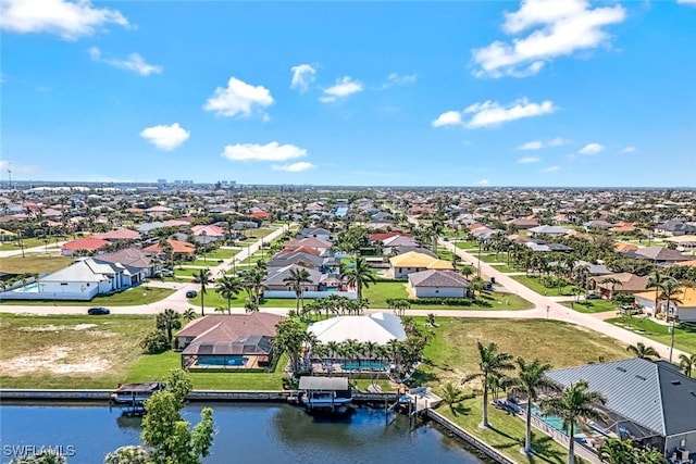 bird's eye view featuring a residential view and a water view