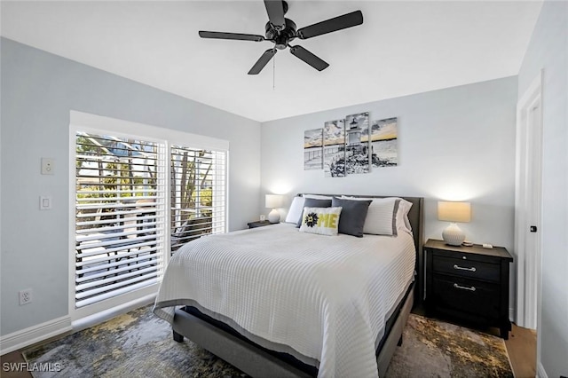 bedroom with baseboards and a ceiling fan