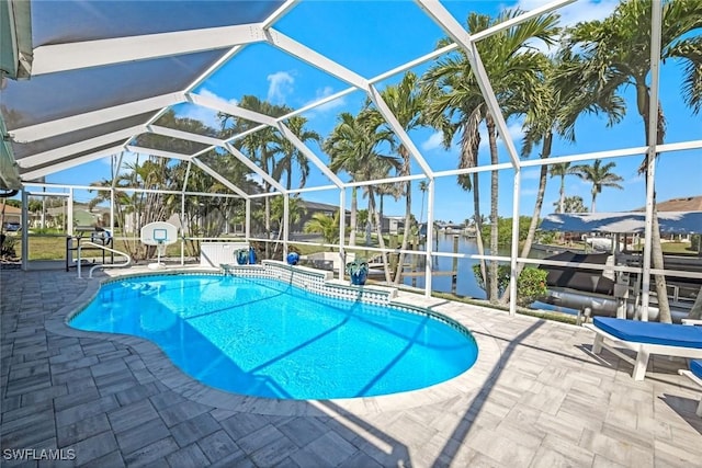 outdoor pool featuring a lanai and a patio