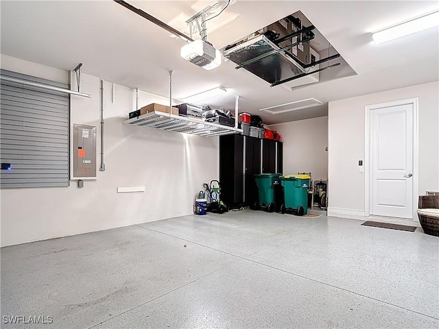 garage featuring electric panel and a garage door opener