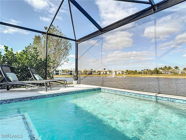 pool featuring a patio area, a lanai, and a water view