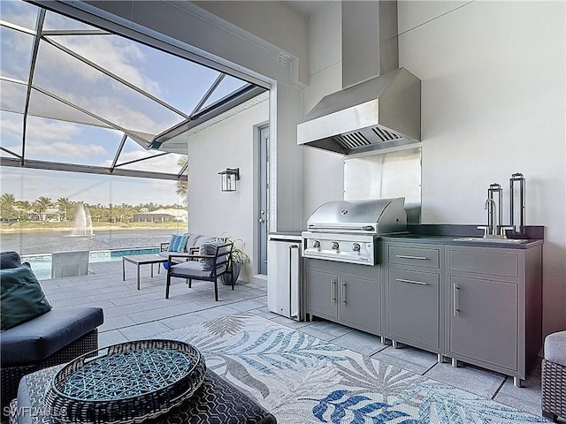 view of patio featuring area for grilling, an outdoor hangout area, a sink, exterior kitchen, and a lanai