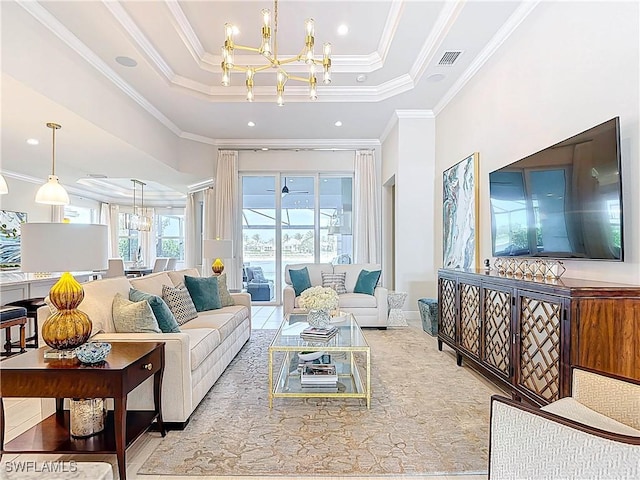 living area with visible vents, a raised ceiling, ornamental molding, a chandelier, and recessed lighting