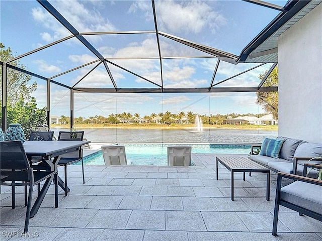 view of patio featuring glass enclosure, a water view, and an outdoor hangout area