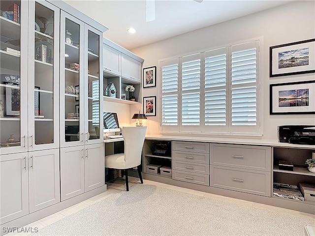 home office featuring light tile patterned floors, recessed lighting, and built in study area