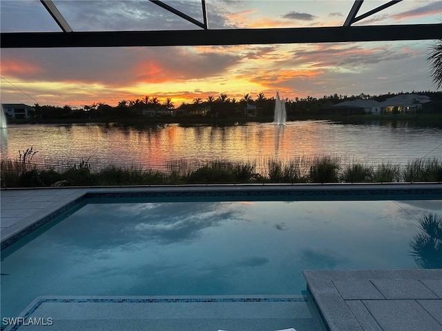 pool with a water view and glass enclosure