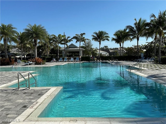 community pool with a patio area