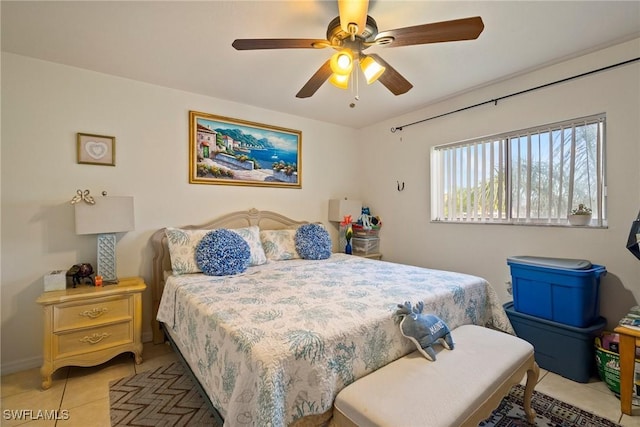 bedroom with a ceiling fan and light tile patterned floors