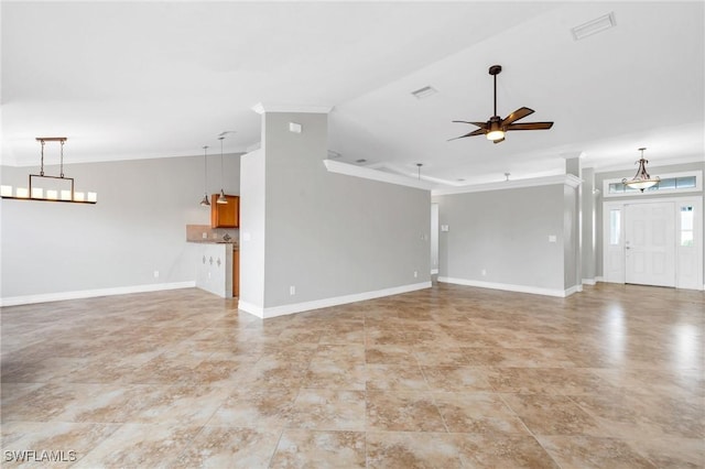 unfurnished living room featuring a ceiling fan, ornamental molding, and baseboards