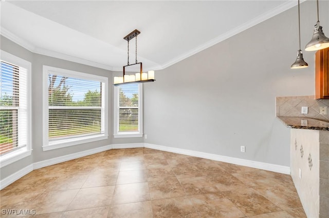 unfurnished dining area featuring light tile patterned floors, baseboards, and crown molding