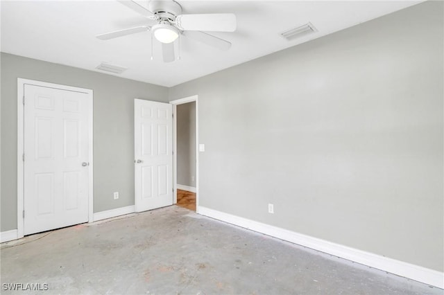 unfurnished bedroom with visible vents, unfinished concrete flooring, and baseboards