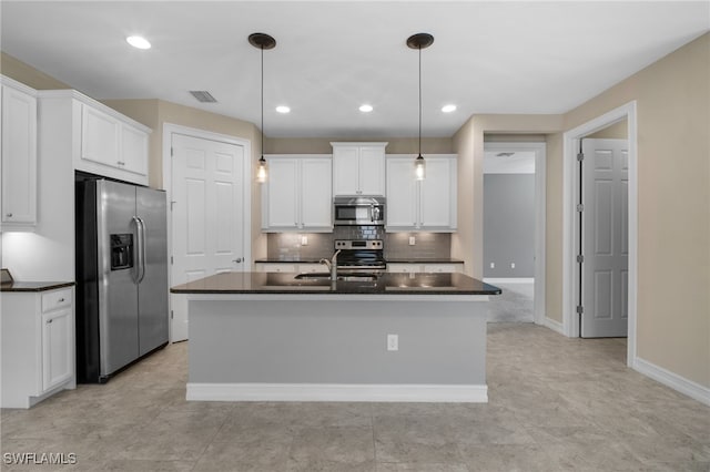 kitchen featuring dark countertops, visible vents, and appliances with stainless steel finishes