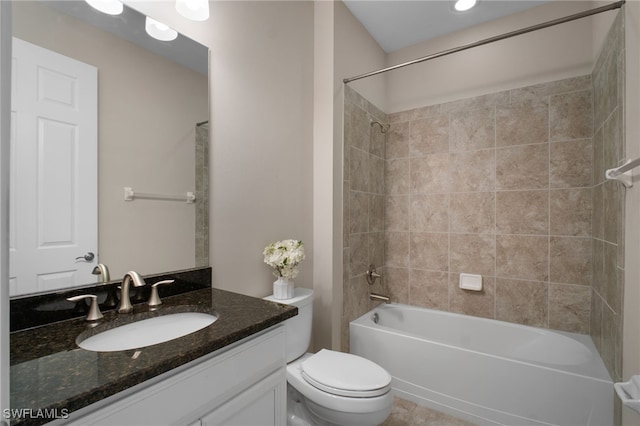 bathroom featuring toilet, vanity, and shower / bathing tub combination