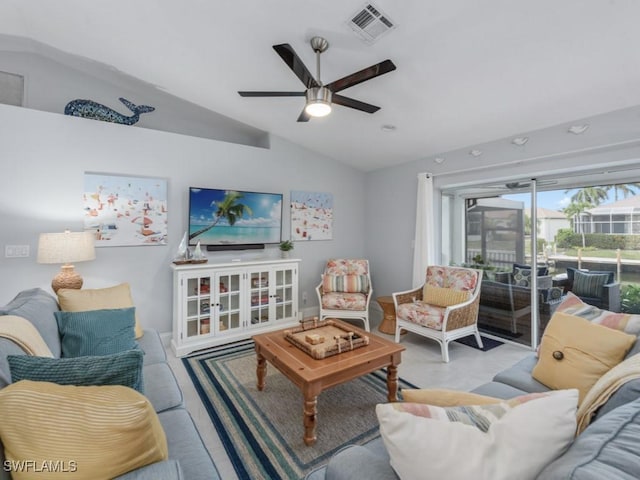 living area featuring a ceiling fan, lofted ceiling, and visible vents