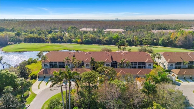 bird's eye view featuring golf course view, a water view, and a wooded view