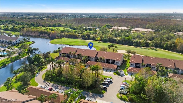 bird's eye view with view of golf course, a water view, and a residential view