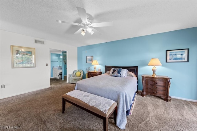 carpeted bedroom featuring baseboards, visible vents, a textured ceiling, and a ceiling fan