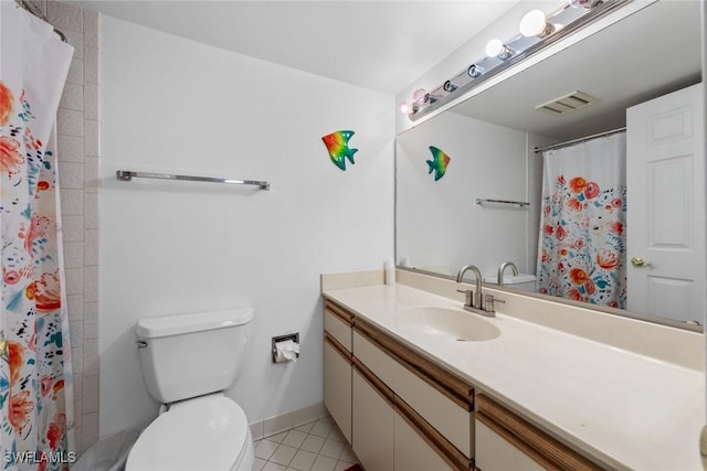 bathroom featuring tile patterned floors, visible vents, toilet, baseboards, and vanity