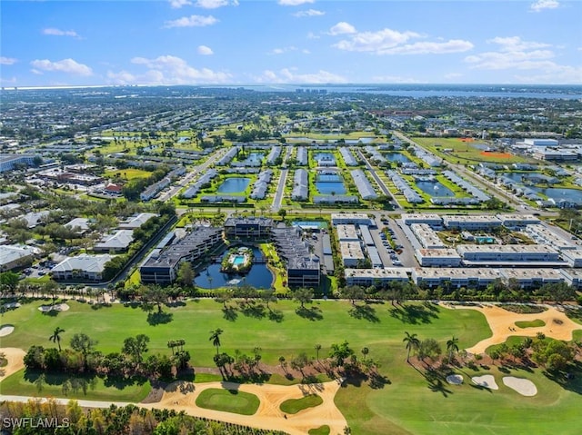 birds eye view of property with view of golf course