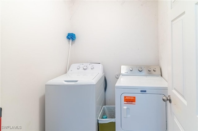 laundry area featuring washing machine and dryer and laundry area