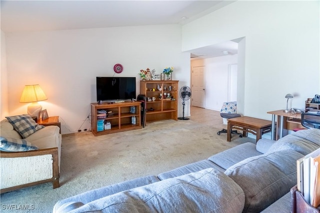 living room with vaulted ceiling and carpet flooring