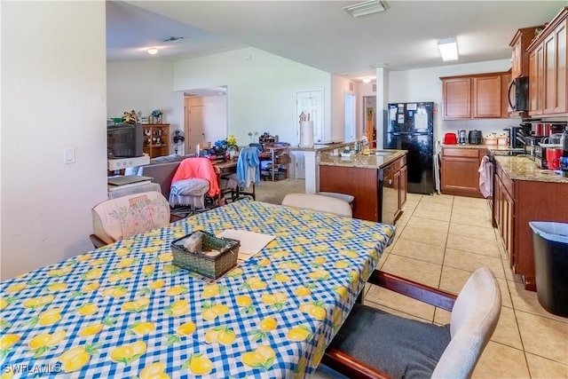 dining space with visible vents and light tile patterned flooring