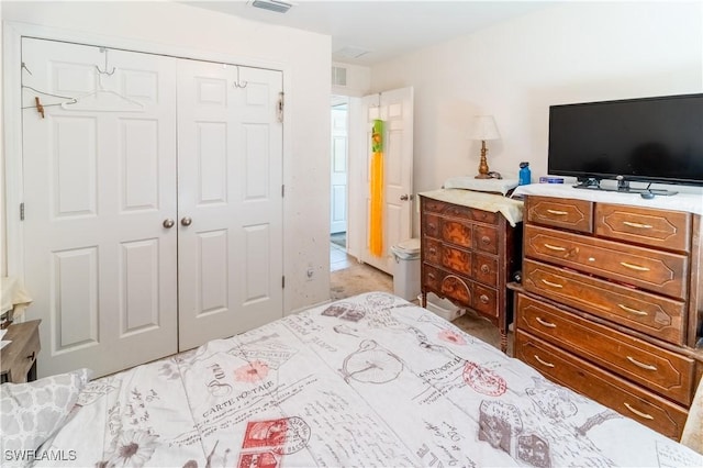 bedroom featuring a closet and visible vents