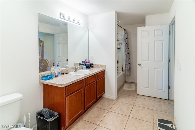 bathroom with toilet, bathing tub / shower combination, vanity, and tile patterned floors