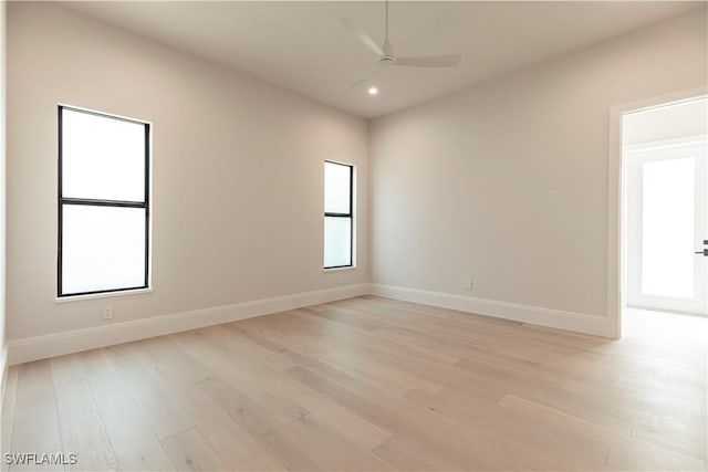 unfurnished room featuring light wood-type flooring, baseboards, a ceiling fan, and recessed lighting