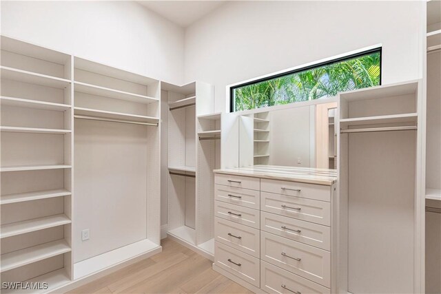 770 Port Side Dr, Naples, FL 34103 - walk in closet featuring light wood-style flooring