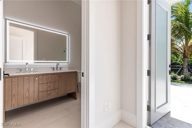770 Port Side Dr, Naples, FL 34103 - bathroom featuring double vanity and tile patterned flooring