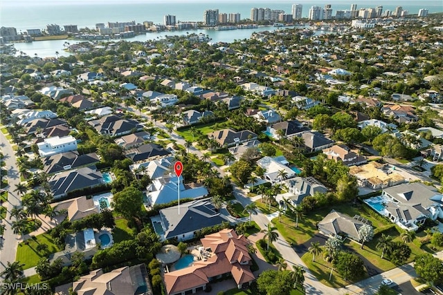 birds eye view of property with a residential view and a water view