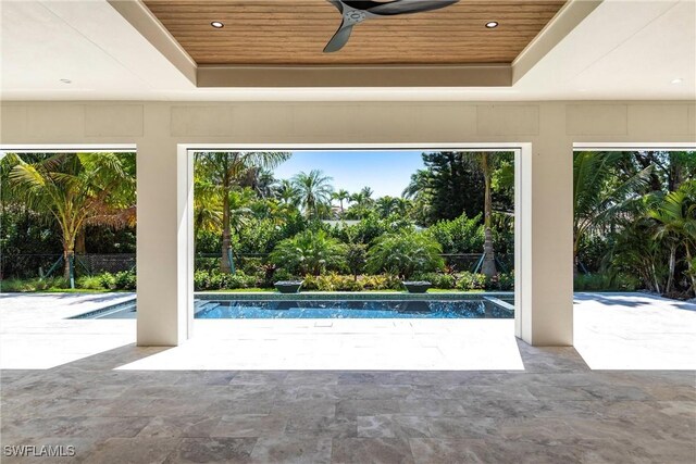 pool featuring a patio area and a ceiling fan