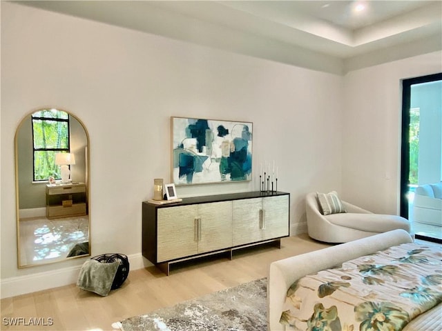 770 Port Side Dr, Naples, FL 34103 - bedroom featuring multiple windows and wood finished floors