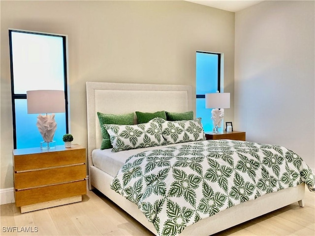 770 Port Side Dr, Naples, FL 34103 - bedroom featuring wood finished floors