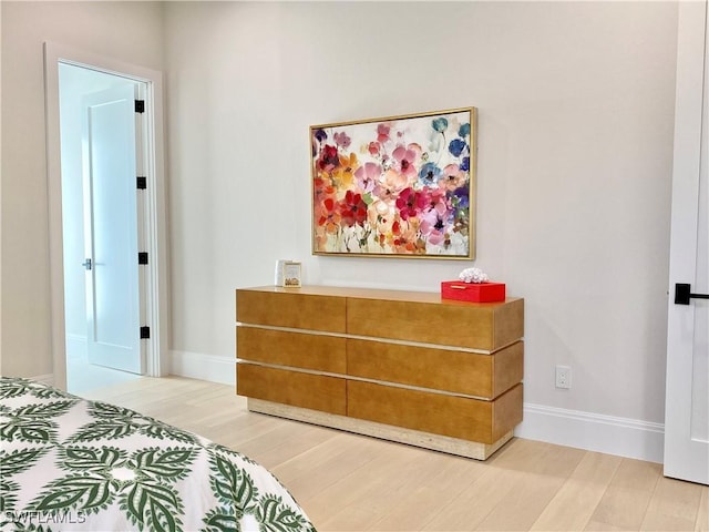 770 Port Side Dr, Naples, FL 34103 - bedroom featuring light wood-type flooring and baseboards