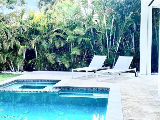770 Port Side Dr, Naples, FL 34103 - view of swimming pool featuring a patio and a pool with connected hot tub